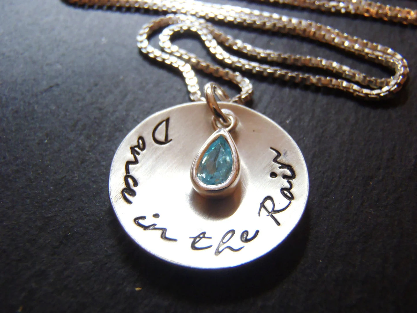 Dance in the rain sterling silver cupped pendant with bezel set blue aquamarine at center on a sterling silver box chain - drake designs jewelry
