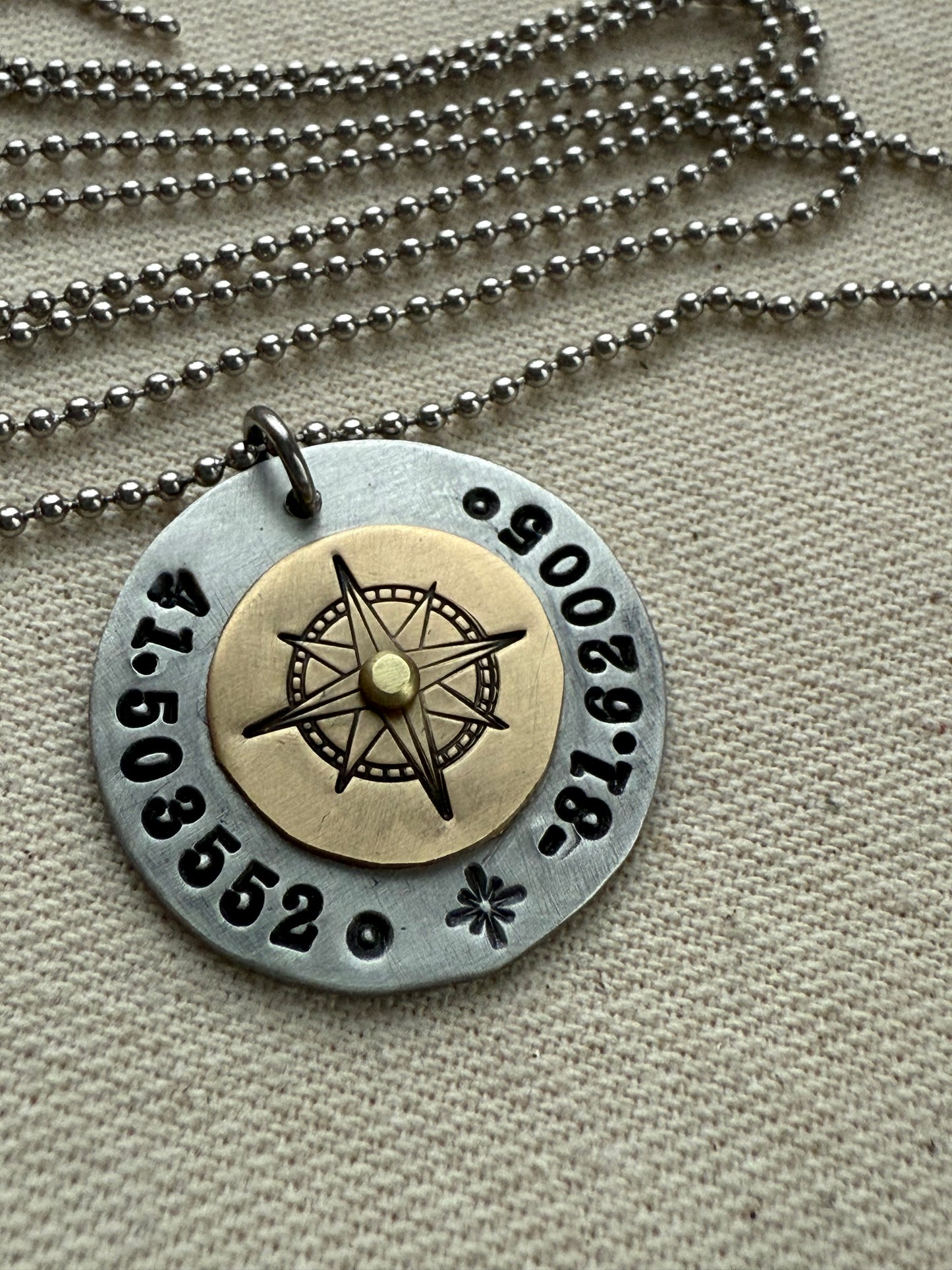 Custom coordinates necklace with gold compass riveted to silver pendant - hand stamped with personalized latitude and longitude - Drake designs jewelry