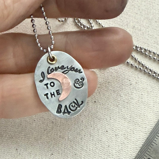 I Love You to the moon and back Necklace - Oval Silver Pendant with hand riveted copper moon and golden brass accents - Drake Designs Jewelry