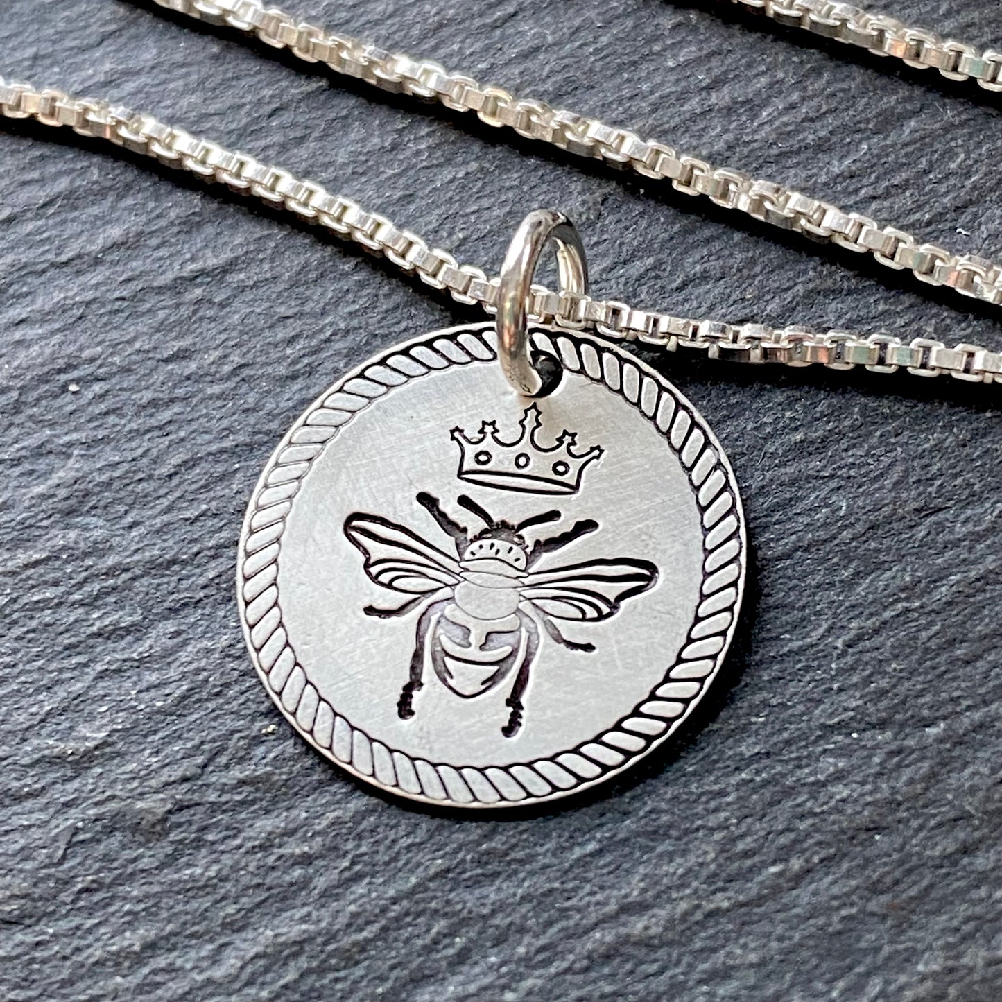Sterling silver Queen bee necklace with rope edge border. hand stamped with a soft brushed finish. drake designs jewelry