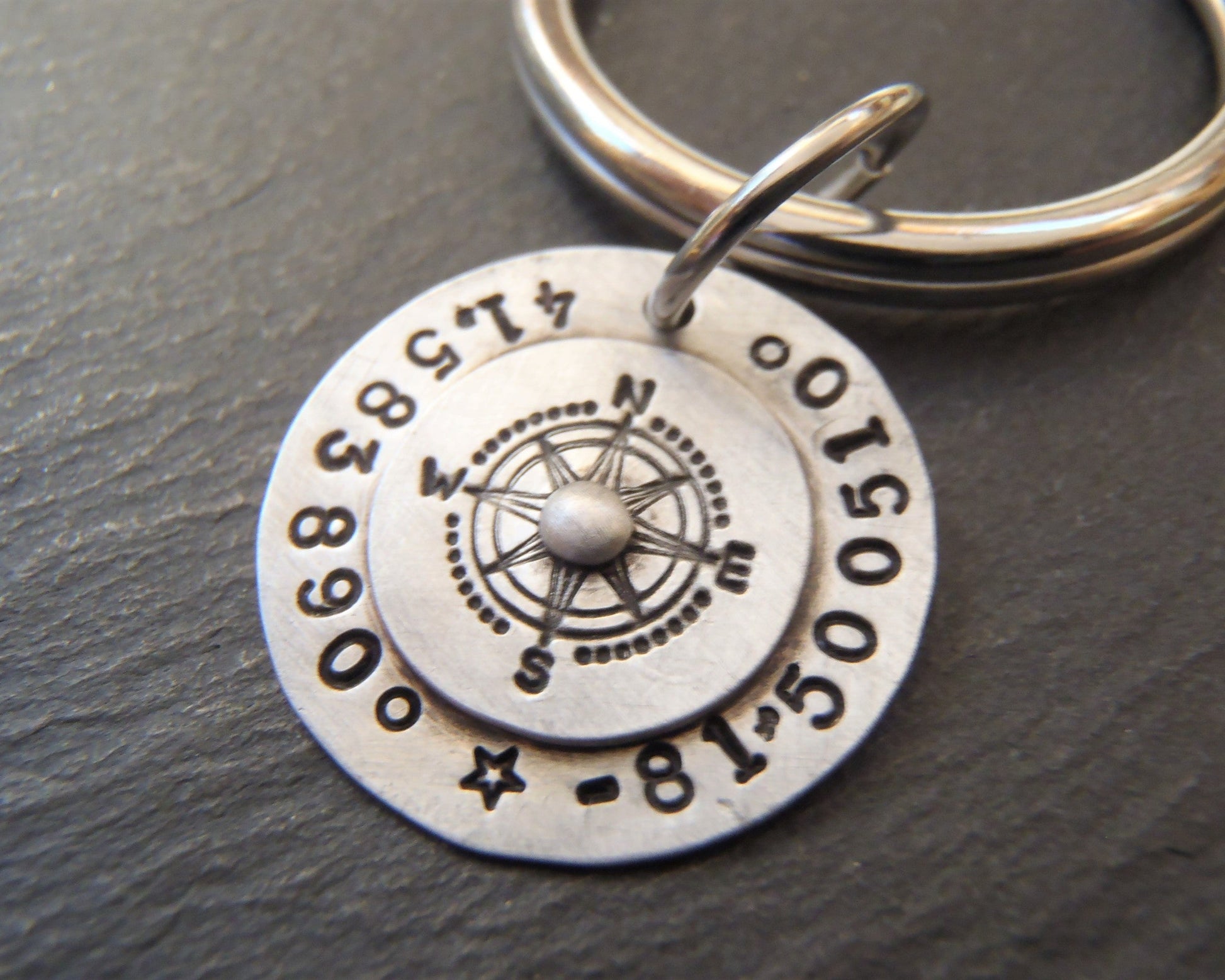 sterling silver keychain personalized with latitude longitude coordinates hand stamped with  riveted compass