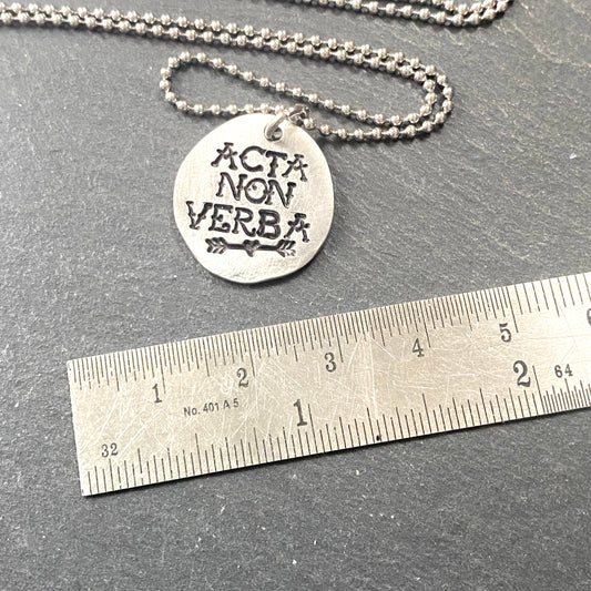 latin quote jewelry. acta non verba. deeds or Actions not words hand stamped on pewter pendant in tattoo font. drake designs jewelry