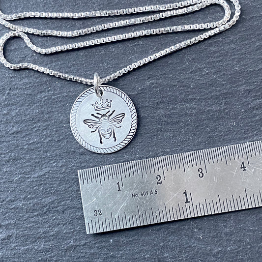 Queen bee necklace with rope edge border. hand stamped on sterling silver. drake designs jewelry