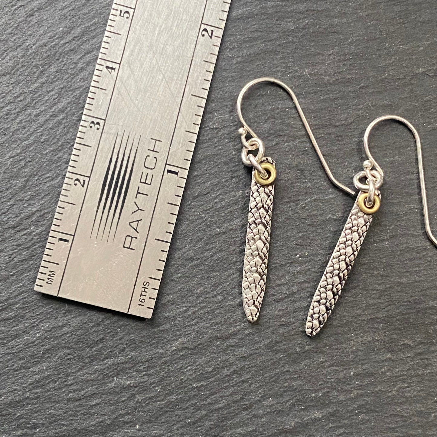 snake print earrings hand crafted from sterling silver and golden brass. snake texture bar dangle earrings. drake designs jewelry