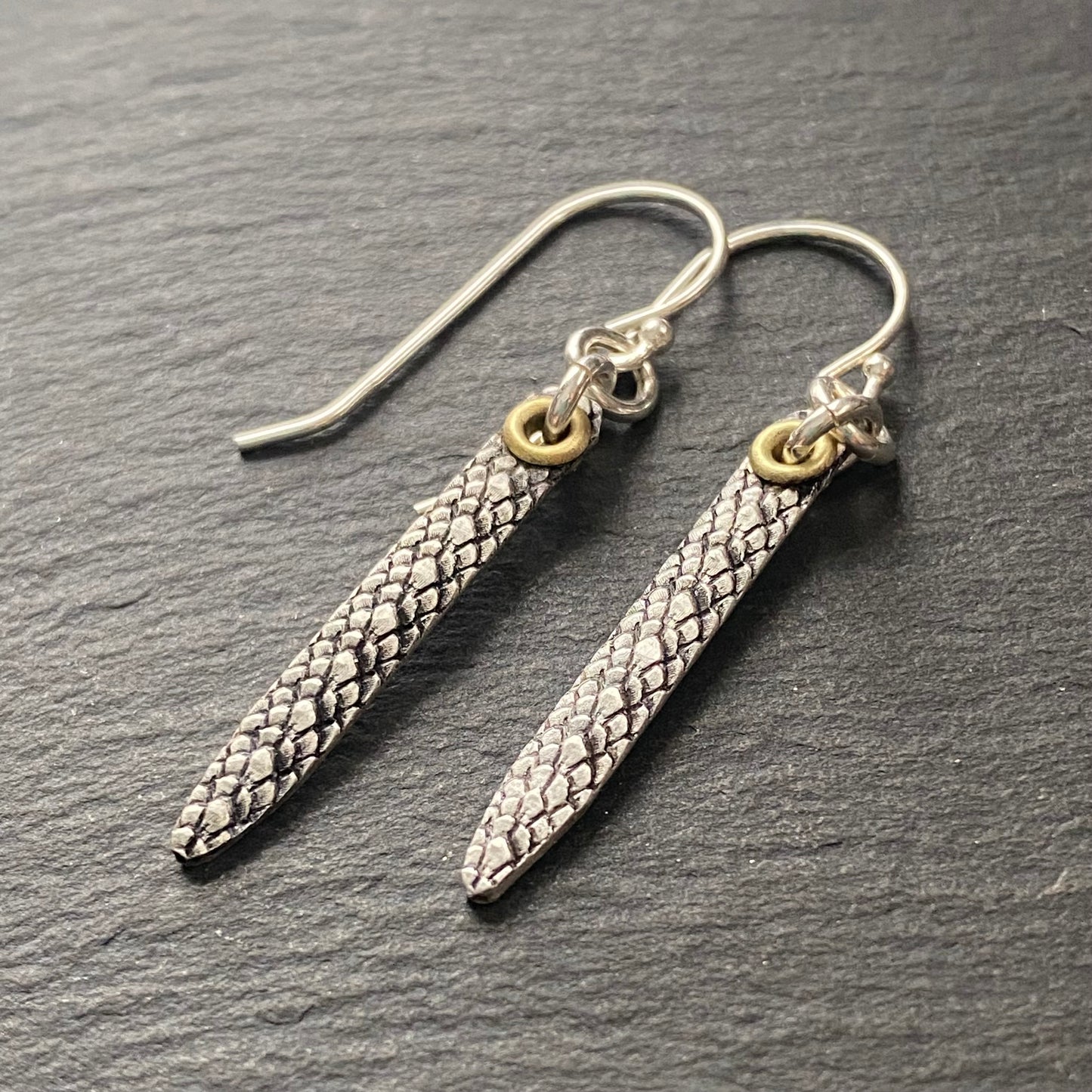 snake print earrings hand crafted from sterling silver and golden brass. snake texture bar dangle earrings. drake designs jewelry