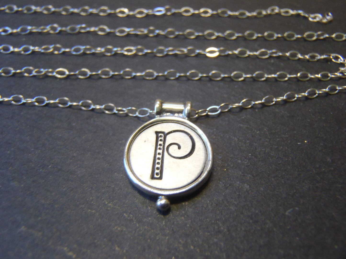 whimsical initial necklace with raised edge in sterling silver - drake designs jewelry