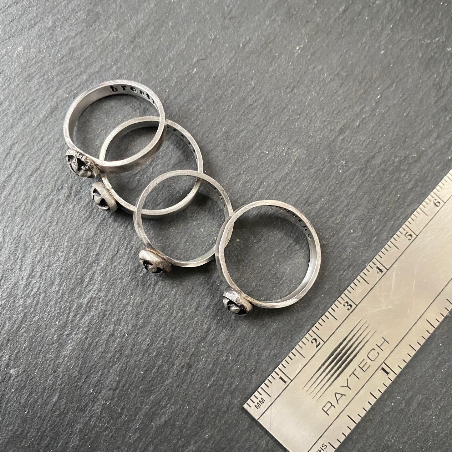 sterling silver lotus flower stacking ring with 'breathe' hand stamped inside, irregular organic shape from melted sterling silver metal - drake designs jewelry