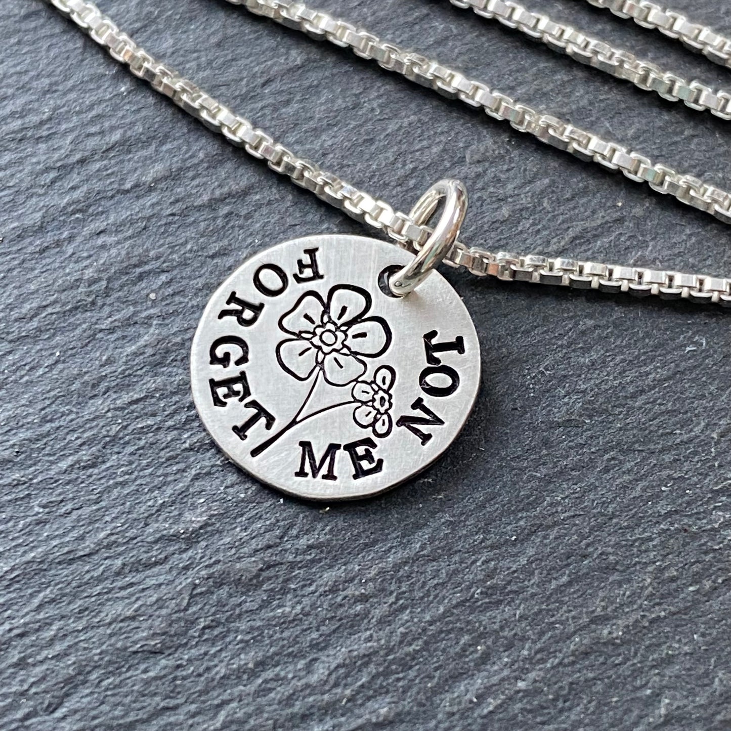 forget me not necklace remembrance gift for sympathy and loss. hand crafted from sterling silver with a brushed finish. Drake designs jewelry