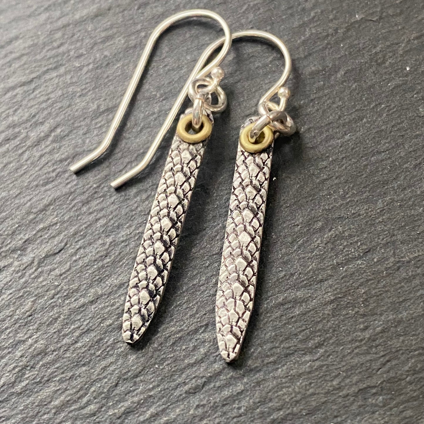snake print earrings hand crafted from sterling silver and golden brass. snake texture bar dangle earrings. drake designs jewelry