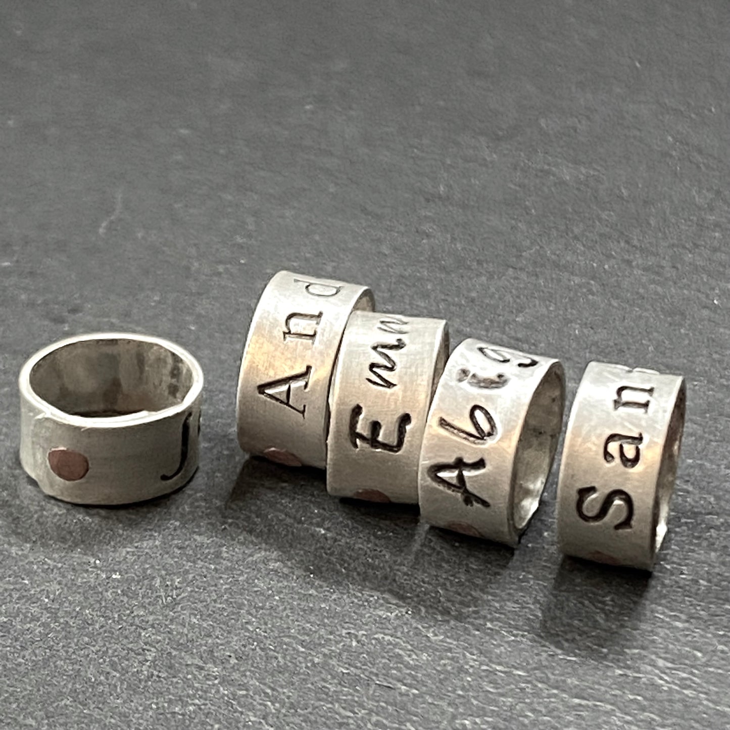 custom sterling silver bead charm riveted by hand with copper rivet. Hand stamped on sterling silver with your choice of font. personalized name charms - drake designs jewelry
