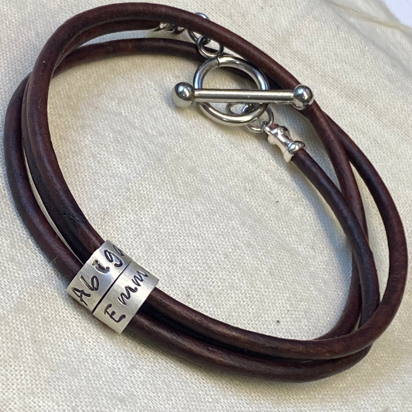triple wrapped  leather bracelet with personalized sterling silver charms with kids names and toggle clasp - drake designs jewelry