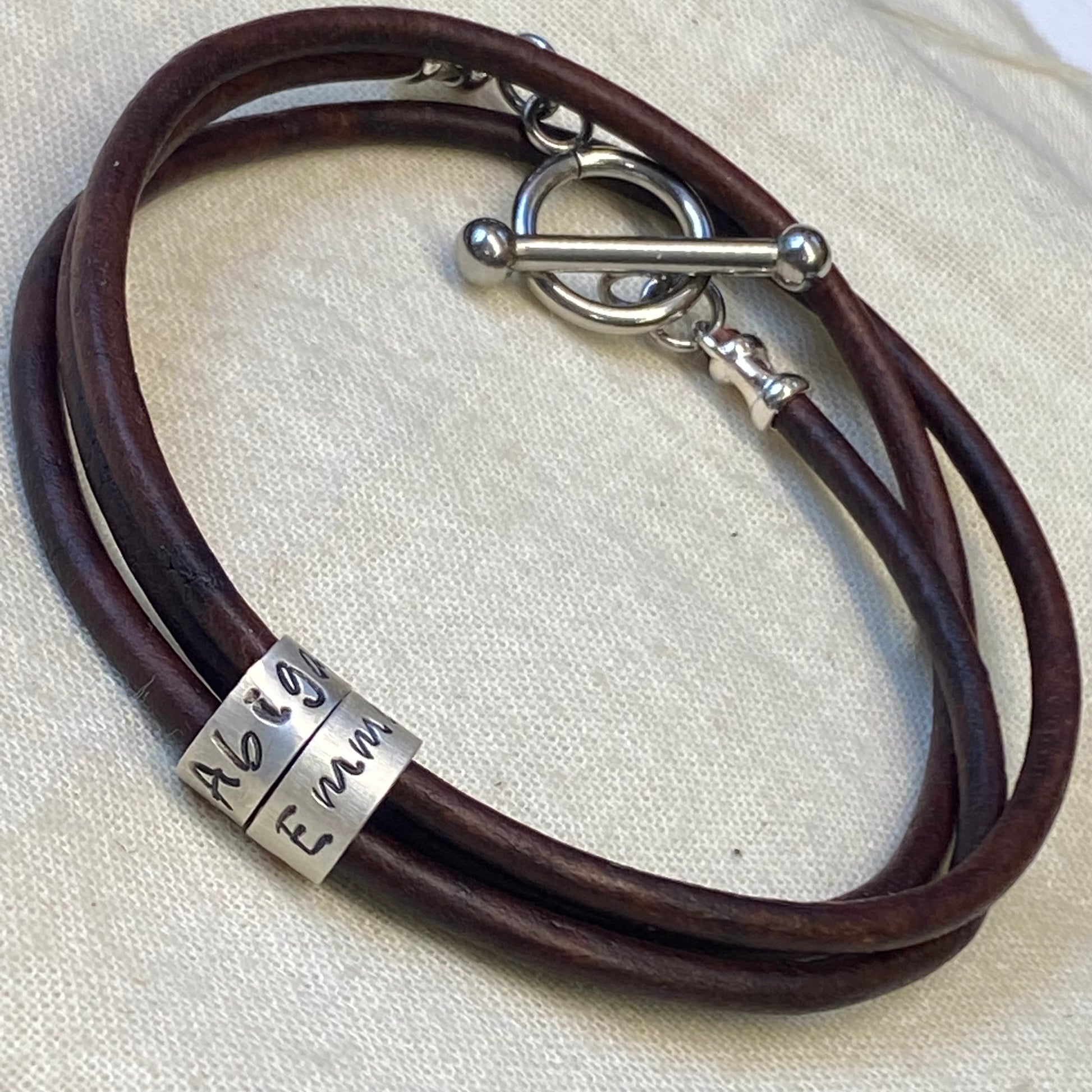 triple wrapped  leather bracelet with personalized sterling silver charms with kids names and toggle clasp - drake designs jewelry