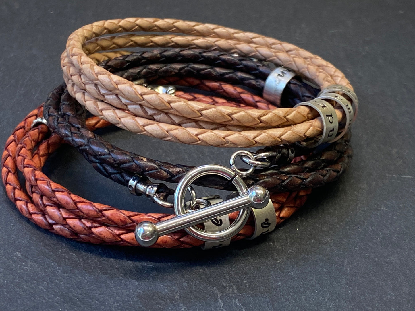 mens braided leather bracelet with toggle clasp and personalized sterling silver name charms