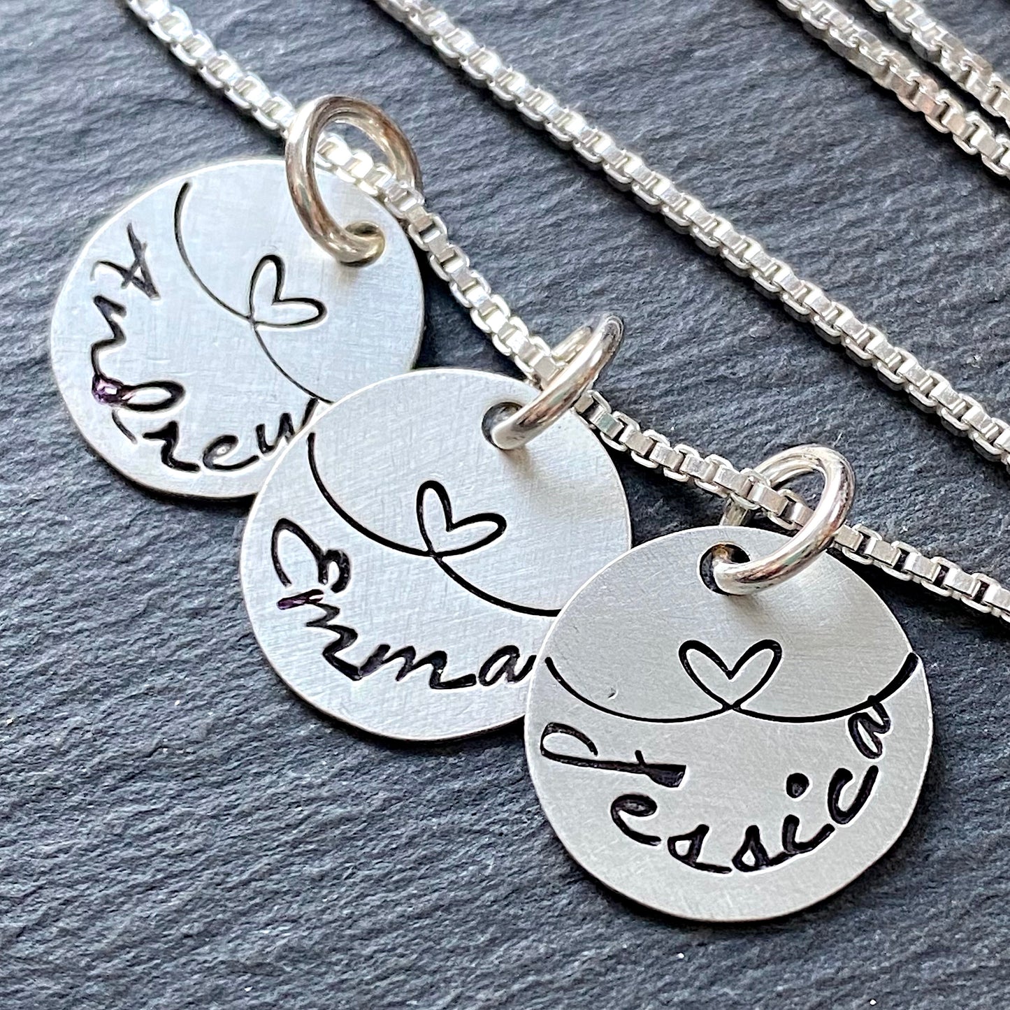 linked by love sterling silver charm mom necklace with kids names and heart links hand stamped. small charm necklace with childrens names. drake designs jewelry