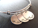 Mother's bracelet with children's name charms in script font on an adjustable bangle bracelet - Drake Designs Jewelry