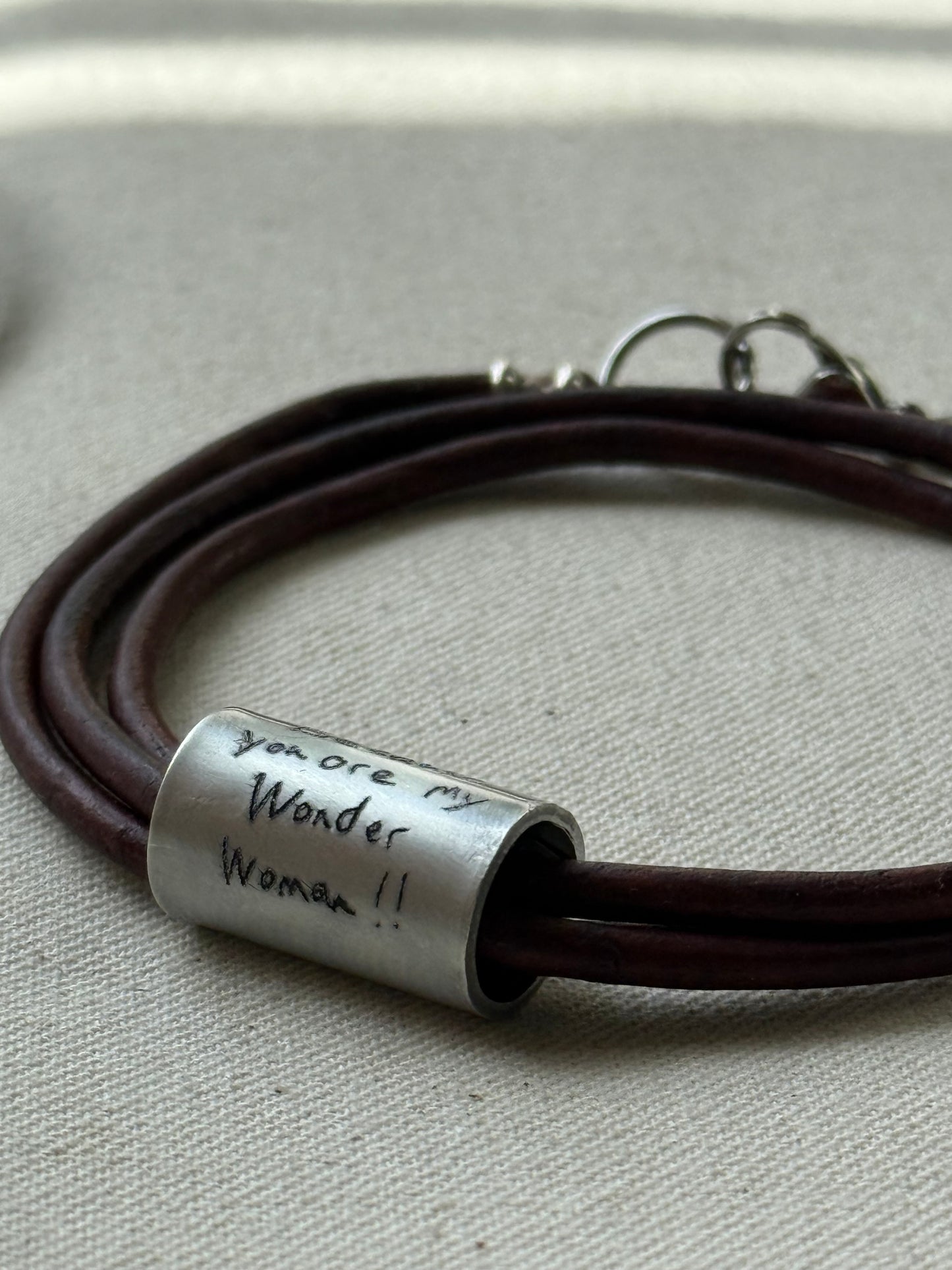 Leather bracelet with cylindrical pendant engraved with loved ones actual handwriting. - drake designs jewelry