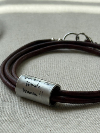 Leather bracelet with cylindrical pendant engraved with loved ones actual handwriting. - drake designs jewelry