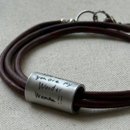 Leather bracelet with cylindrical pendant engraved with loved ones actual handwriting. - drake designs jewelry