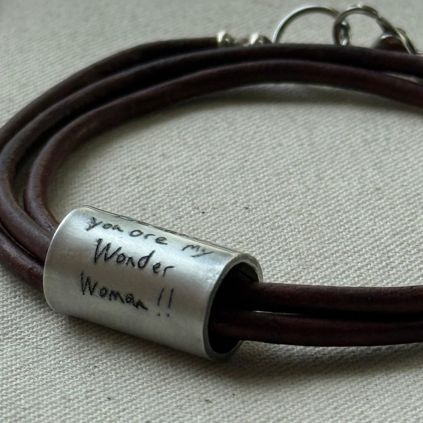 Leather bracelet with cylindrical pendant engraved with loved ones actual handwriting. - drake designs jewelry