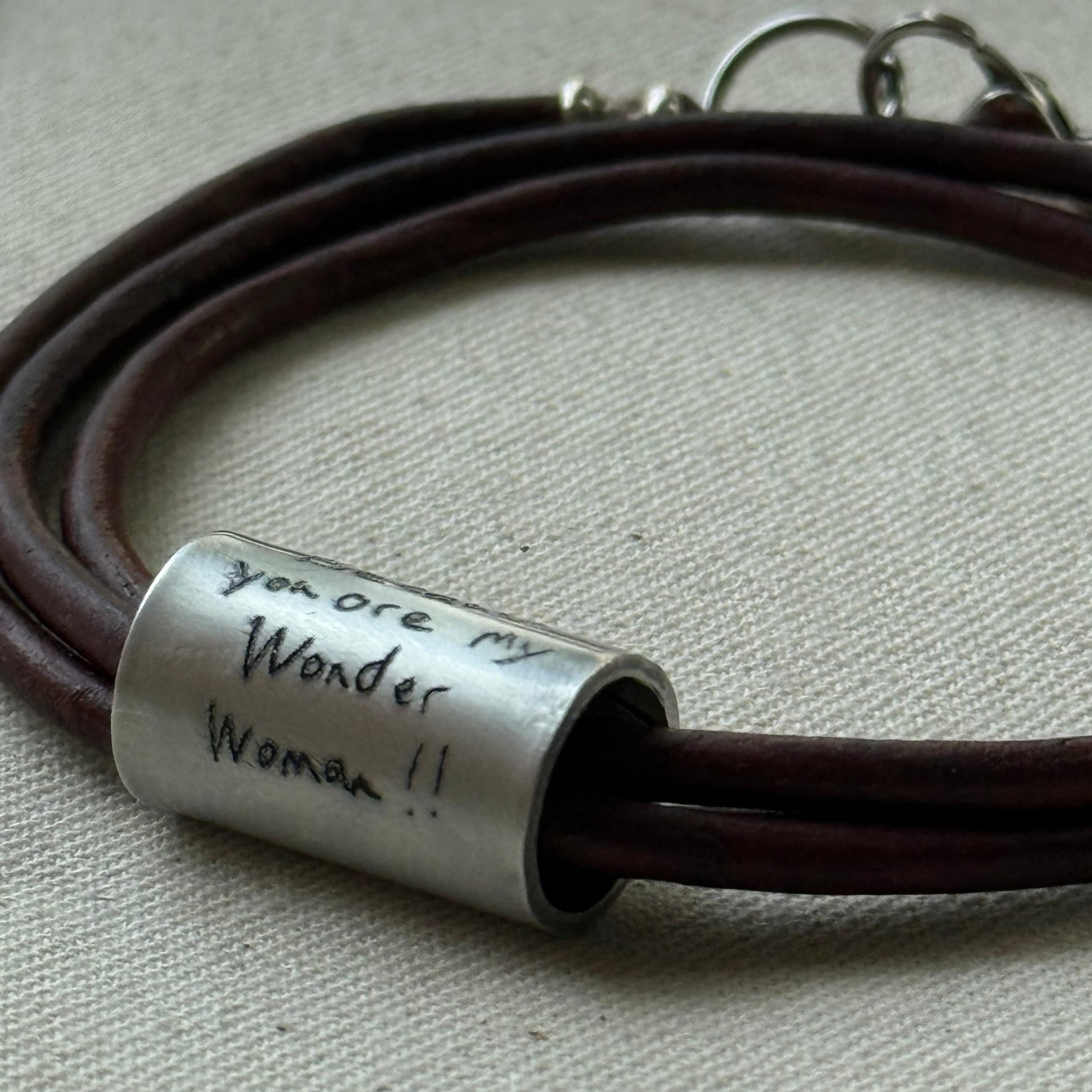 Leather bracelet with cylindrical pendant engraved with loved ones actual handwriting. - drake designs jewelry