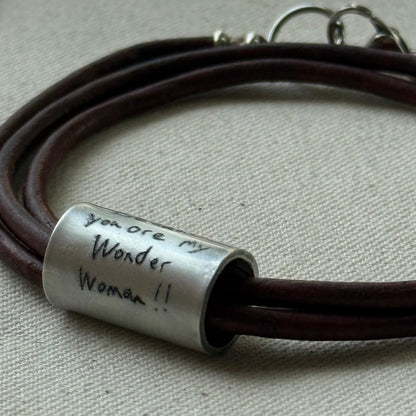 Leather bracelet with cylindrical pendant engraved with loved ones actual handwriting. - drake designs jewelry