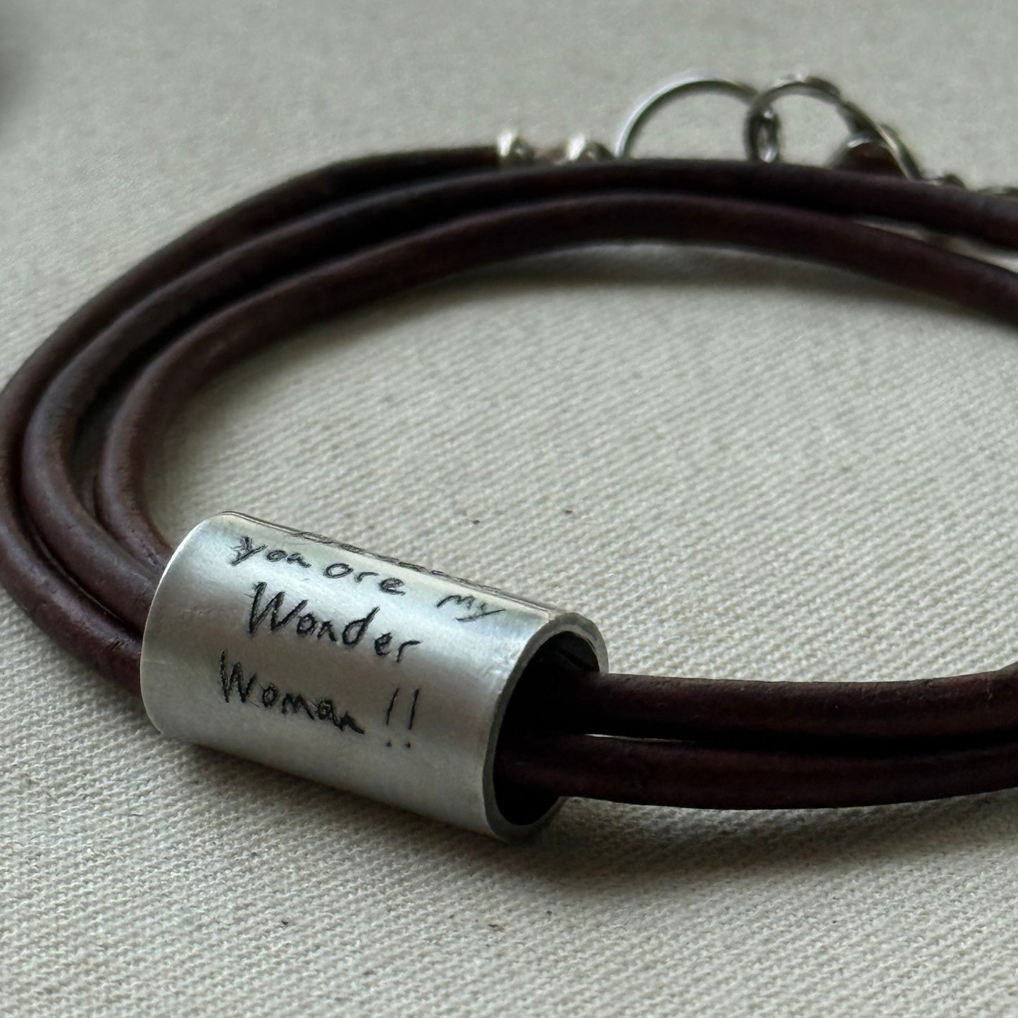 Leather bracelet with cylindrical pendant engraved with loved ones actual handwriting. - drake designs jewelry