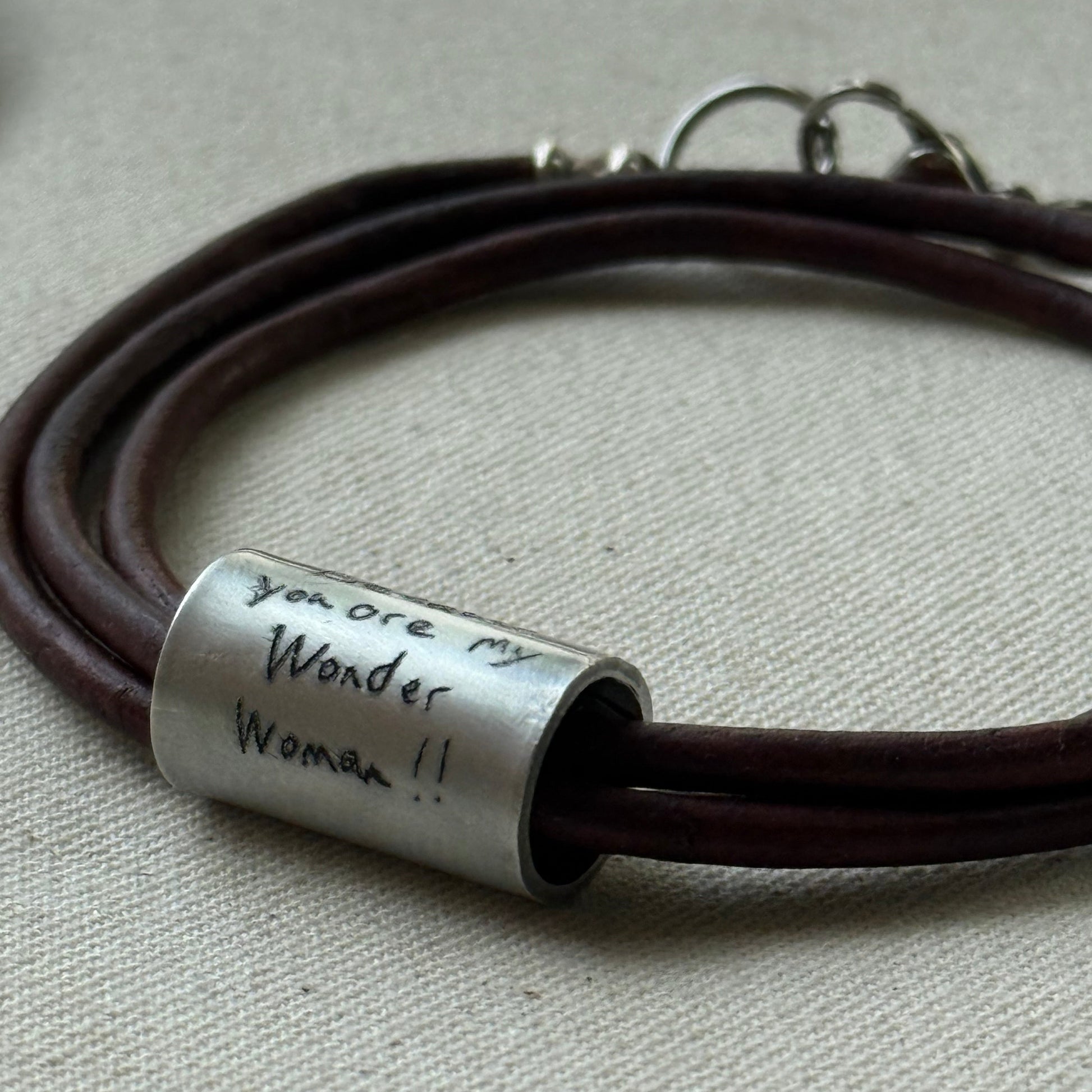 Leather bracelet with cylindrical pendant engraved with loved ones actual handwriting. - drake designs jewelry