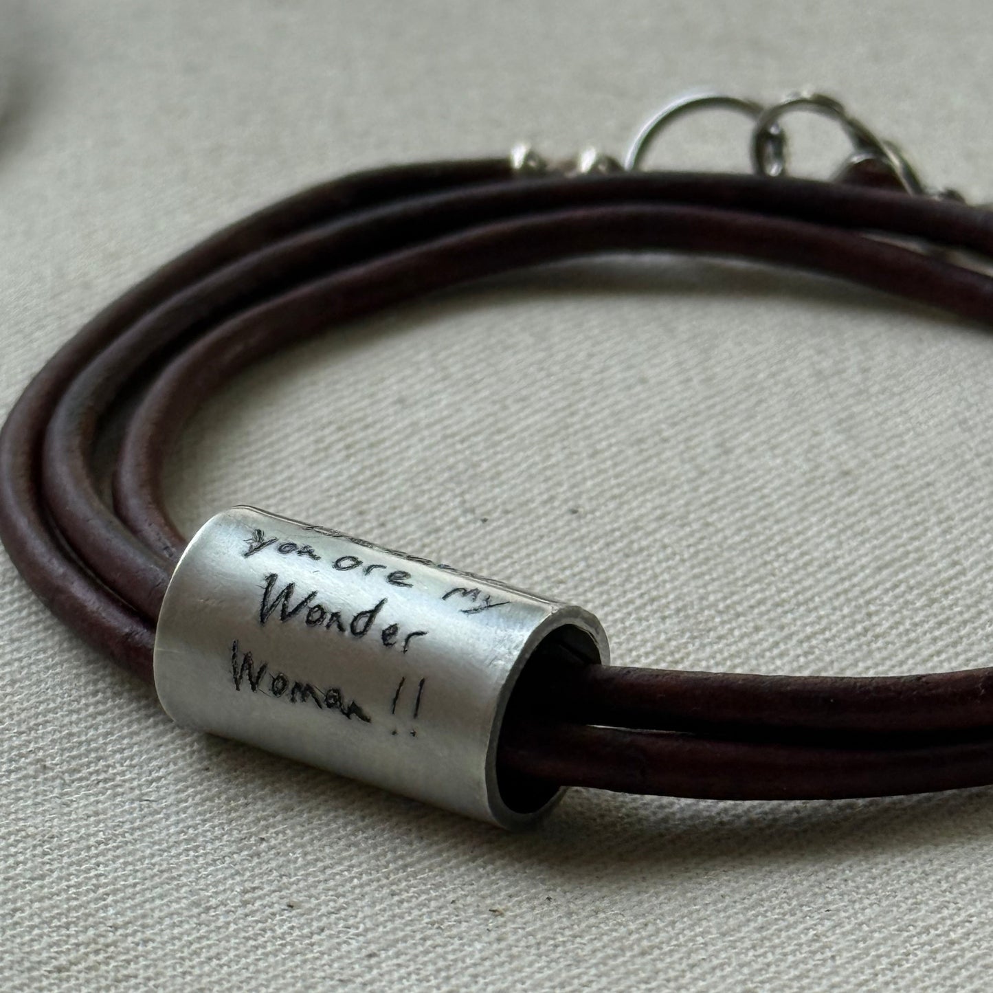 Leather bracelet with cylindrical pendant engraved with loved ones actual handwriting. - drake designs jewelry