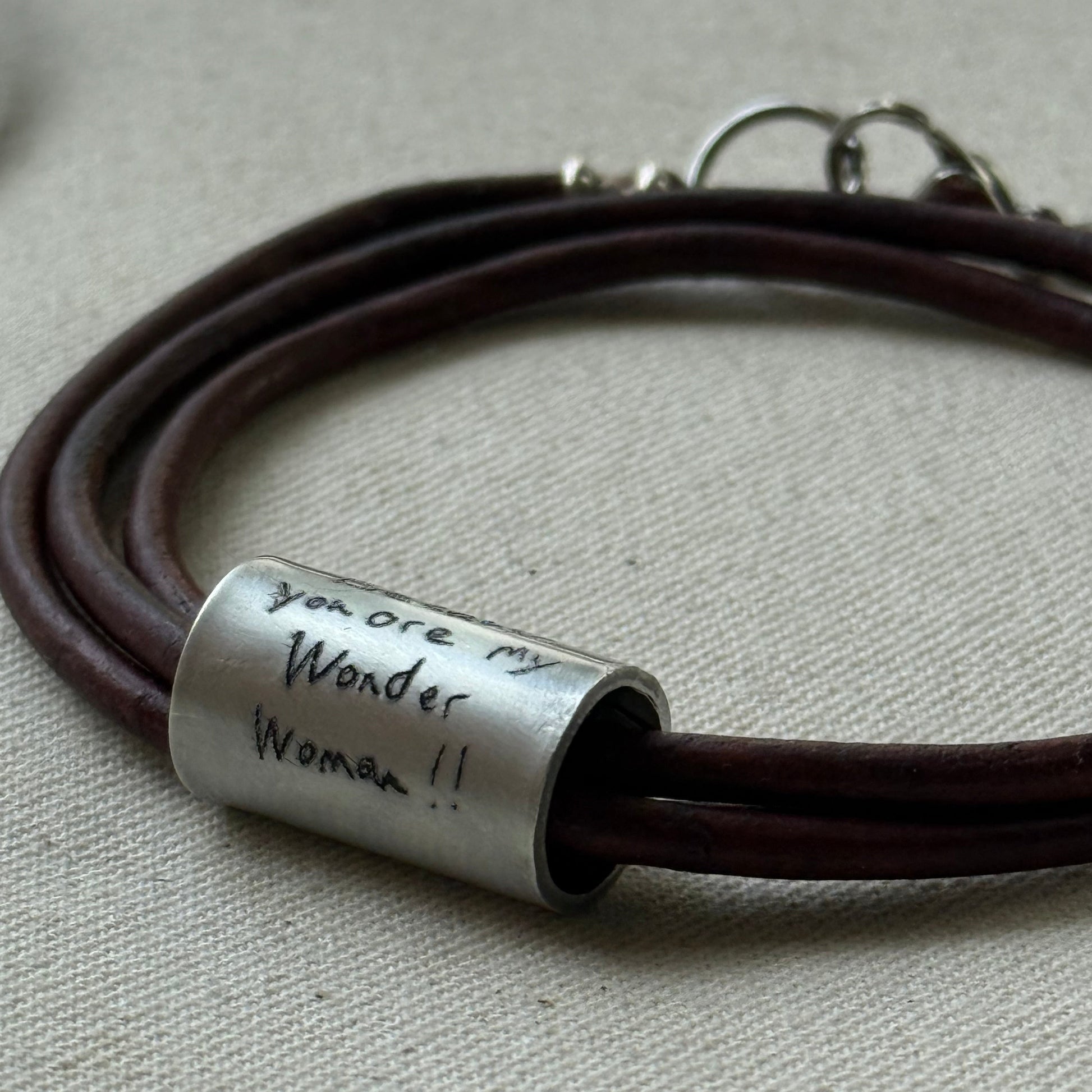 Leather bracelet with cylindrical pendant engraved with loved ones actual handwriting. - drake designs jewelry
