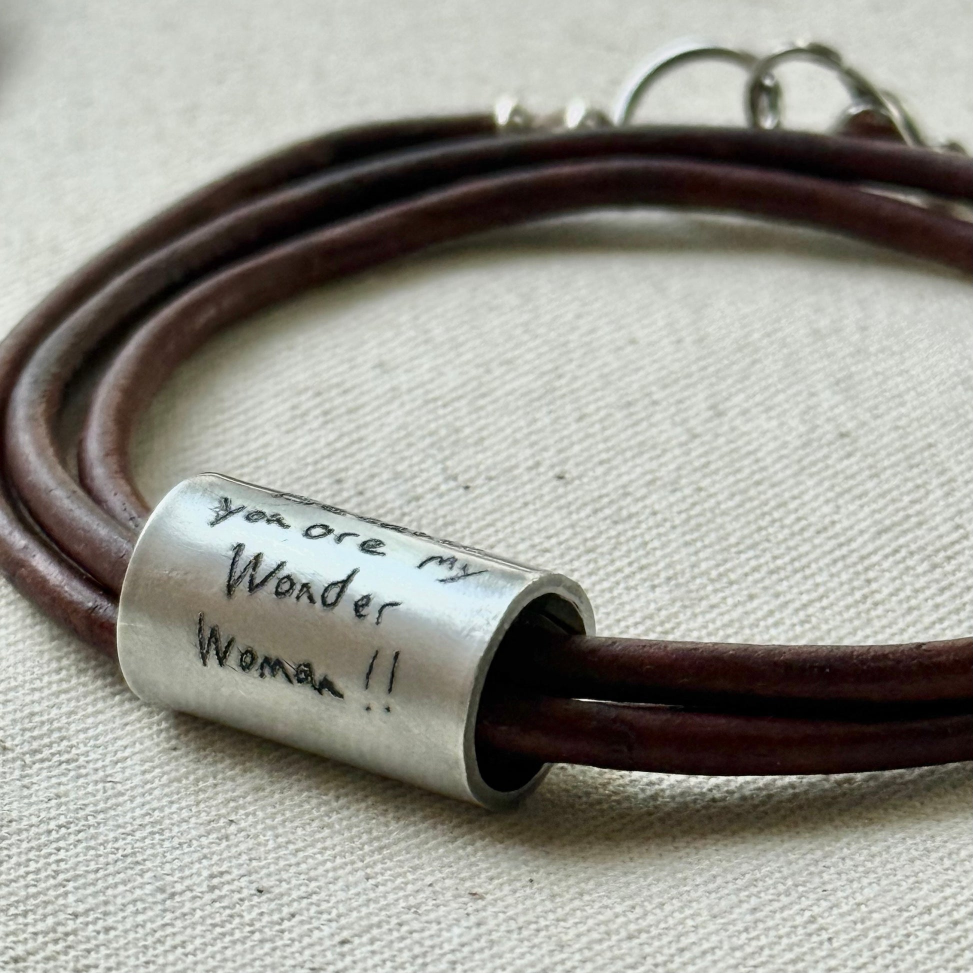 Leather bracelet with cylindrical pendant engraved with loved ones actual handwriting. - drake designs jewelry