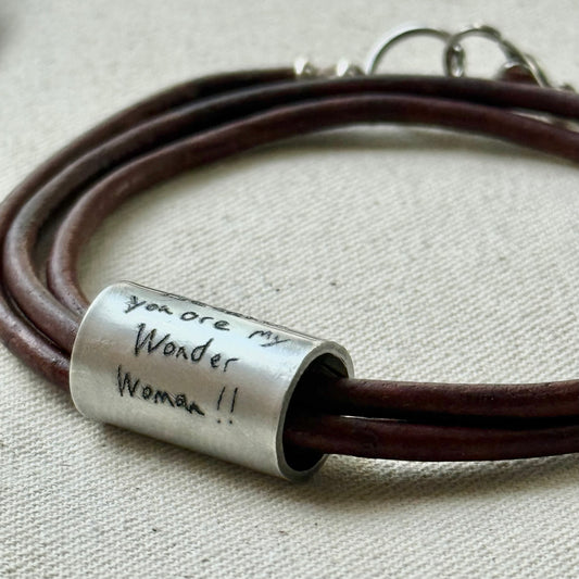 Leather bracelet with cylindrical pendant engraved with loved ones actual handwriting. - drake designs jewelry