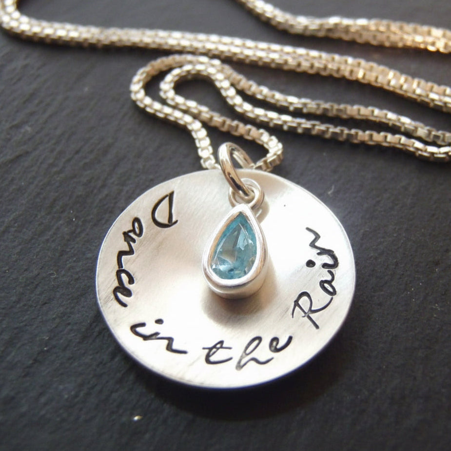 Dance in the rain sterling silver cupped pendant with bezel set blue aquamarine at center on a sterling silver box chain - drake designs jewelry