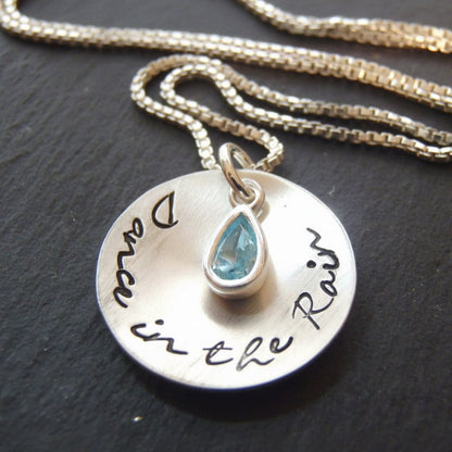 Dance in the rain sterling silver cupped pendant with bezel set blue aquamarine at center on a sterling silver box chain - drake designs jewelry