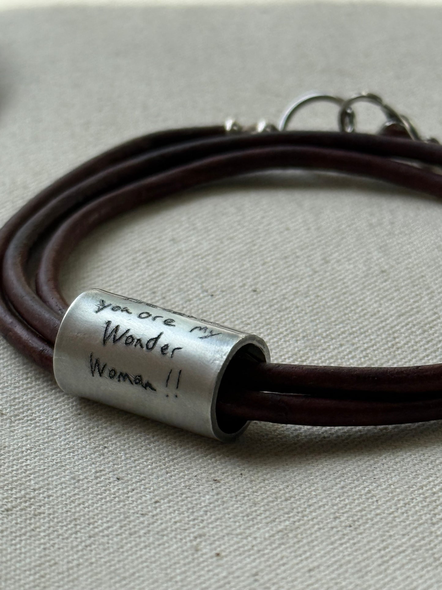 Leather bracelet with cylindrical pendant engraved with loved ones actual handwriting. - drake designs jewelry