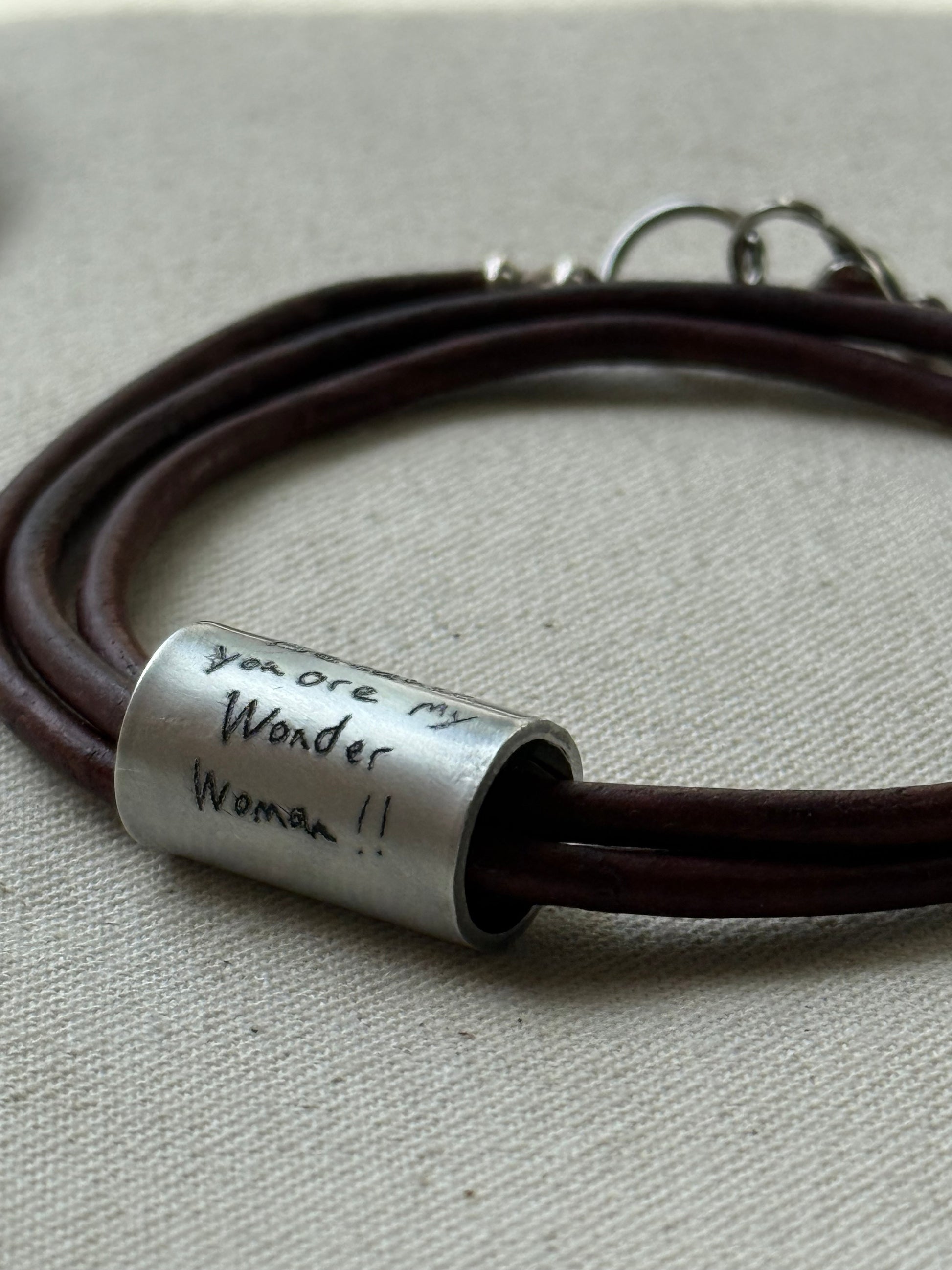 Leather bracelet with cylindrical pendant engraved with loved ones actual handwriting. - drake designs jewelry