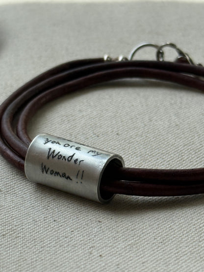 Leather bracelet with cylindrical pendant engraved with loved ones actual handwriting. - drake designs jewelry