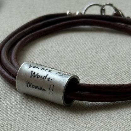 Leather bracelet with cylindrical pendant engraved with loved ones actual handwriting. - drake designs jewelry