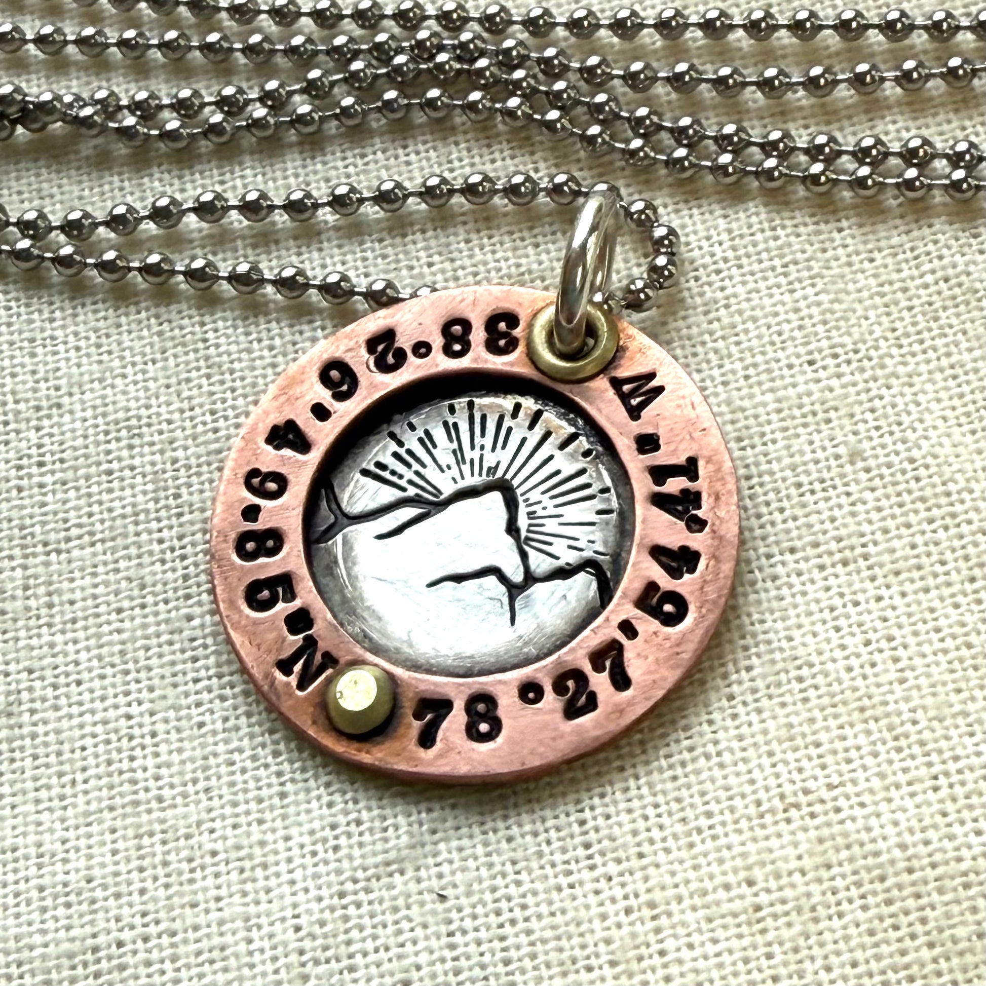 personalized mountain necklace sterling silver with copper and golden brass with custom coordinates hand crafted by drake designs jewelry