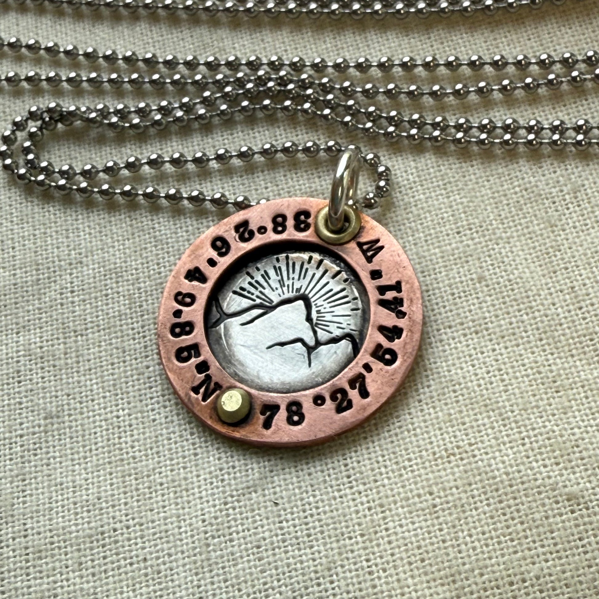 personalized mountain necklace sterling silver with copper and golden brass with custom latitude and  longitude hand crafted by drake designs jewelry