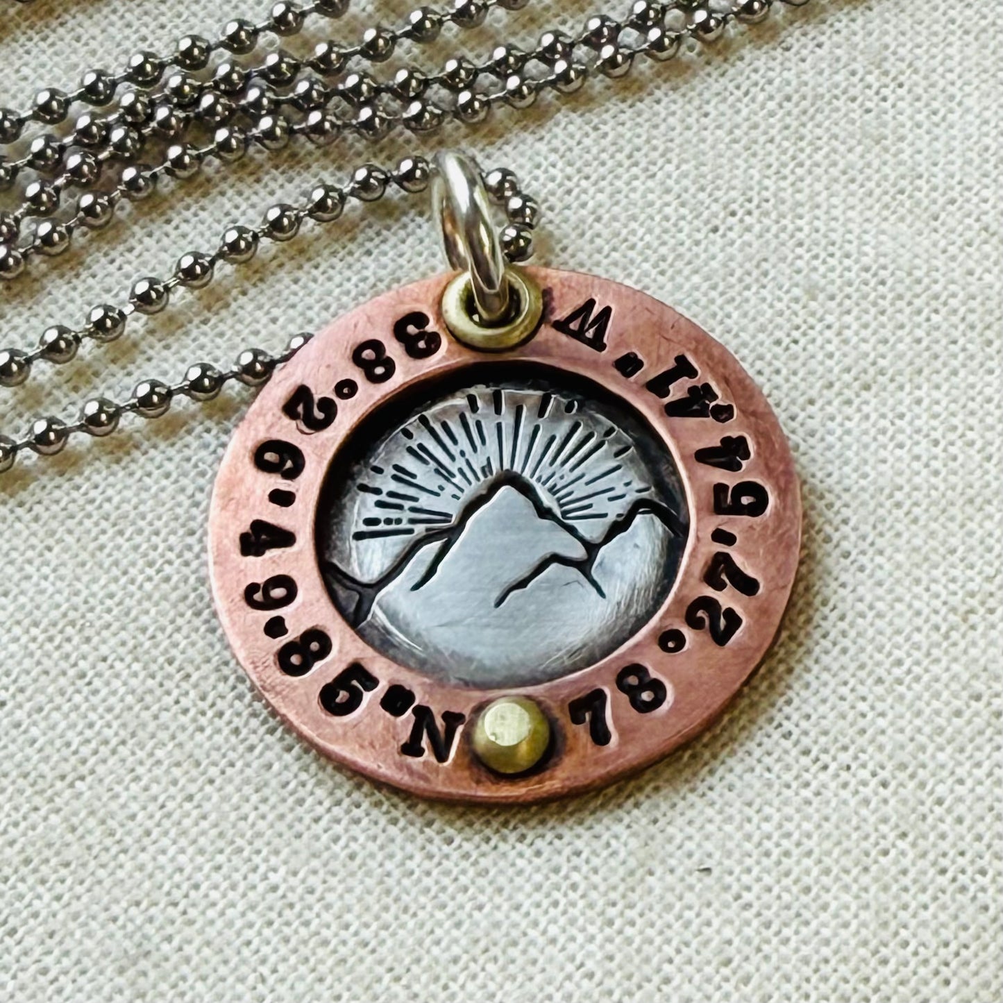 personalized mountain necklace sterling silver with copper and golden brass with custom coordinates hand crafted by drake designs jewelry