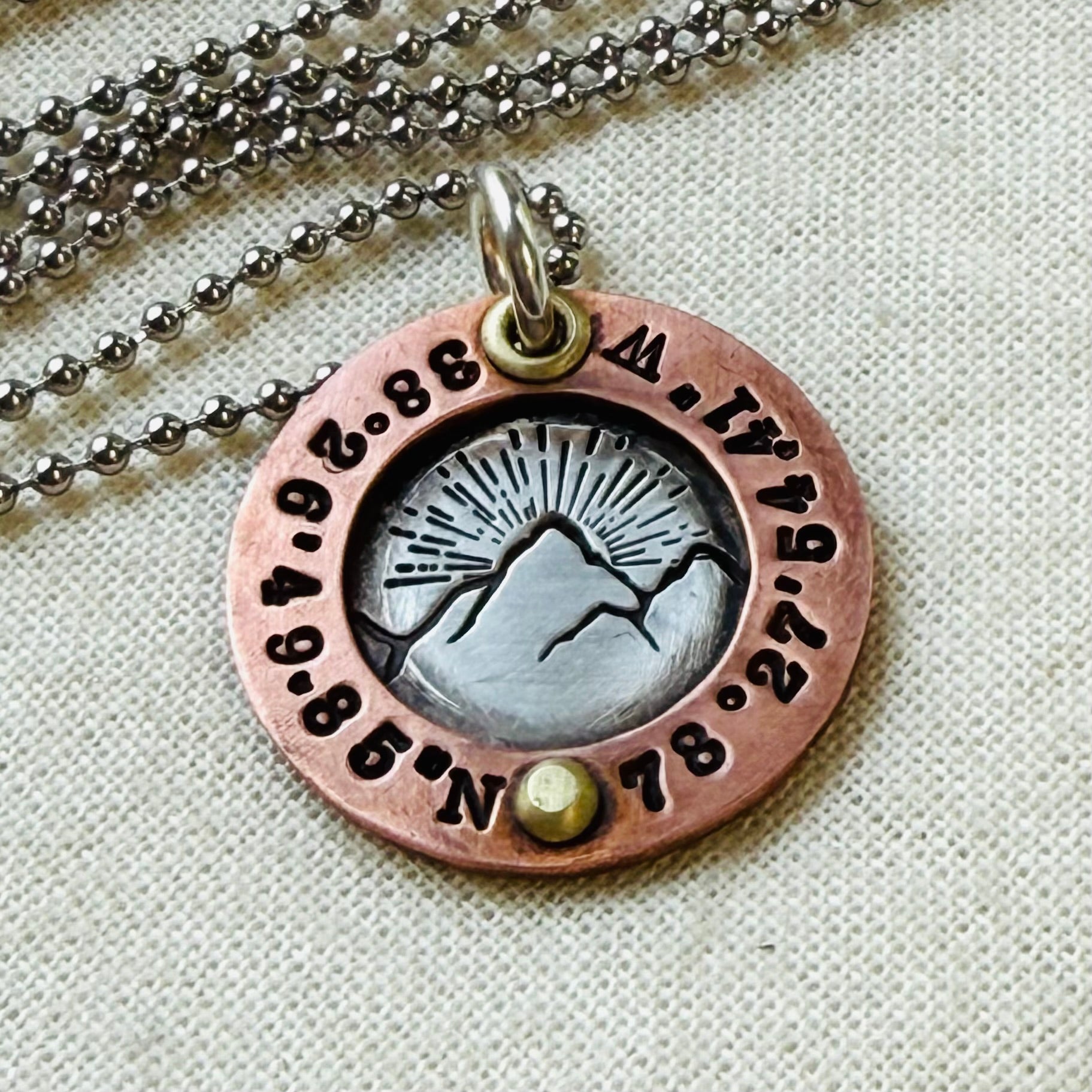personalized mountain necklace sterling silver with copper and golden brass with custom coordinates hand crafted by drake designs jewelry