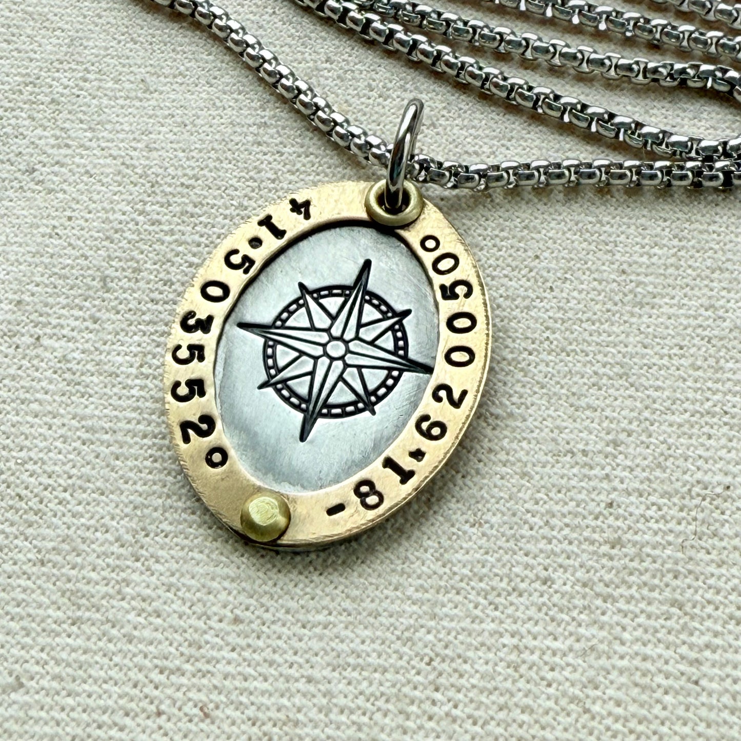 Gold Rimmed silver custom coordinates necklace with compass rose at center hand stamped and riveted by hand - drake designs jewelry