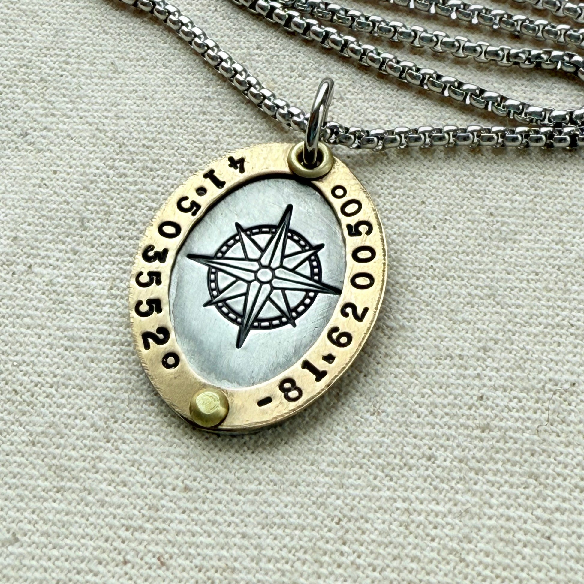Gold Rimmed silver custom coordinates necklace with compass rose at center hand stamped and riveted by hand - drake designs jewelry
