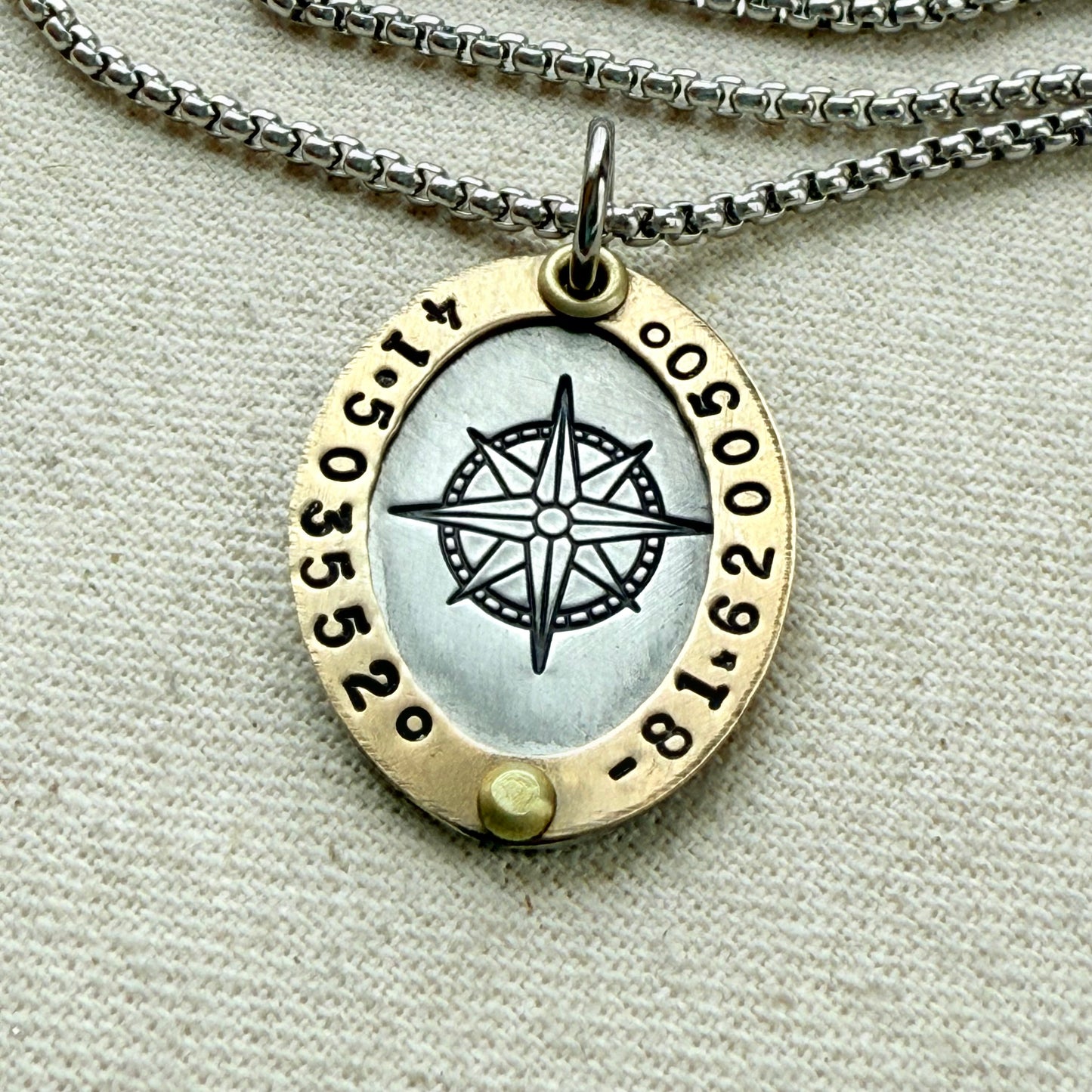 Oval Gold Rimmed custom coordinates necklace with compass rose at center hand stamped and riveted by hand - drake designs jewelry