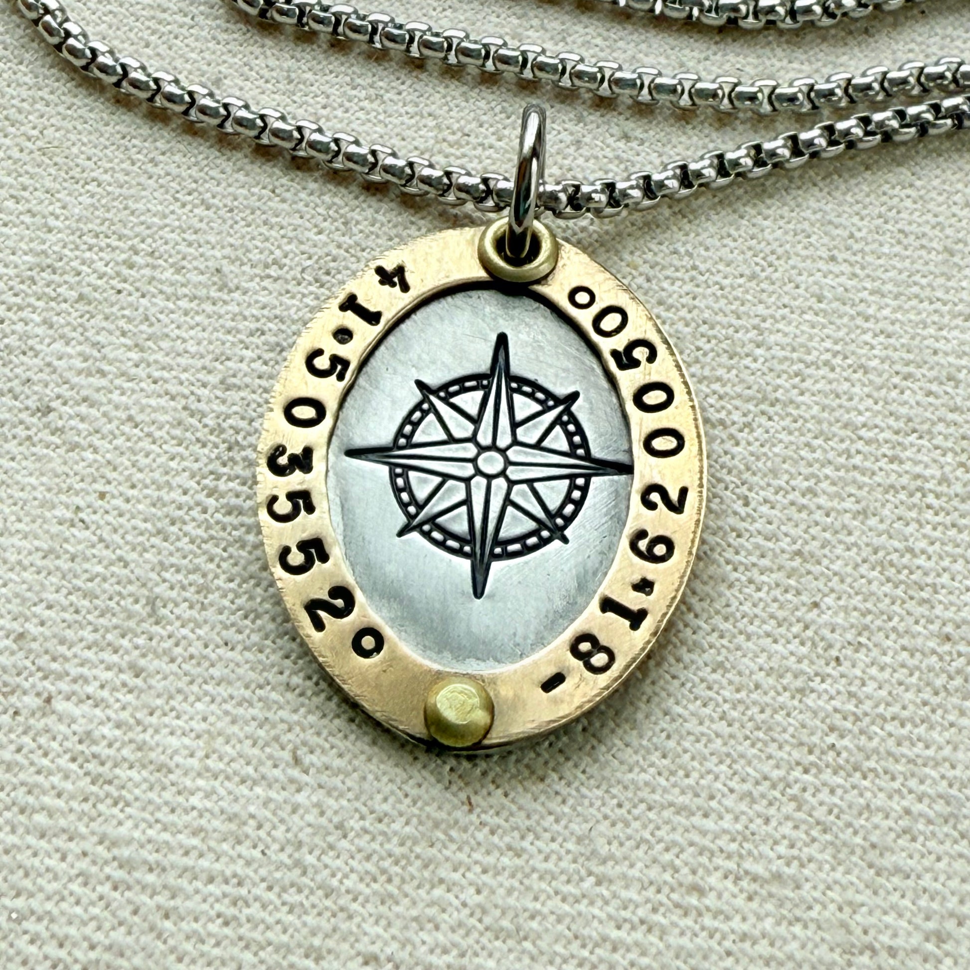 Oval Gold Rimmed custom coordinates necklace with compass rose at center hand stamped and riveted by hand - drake designs jewelry