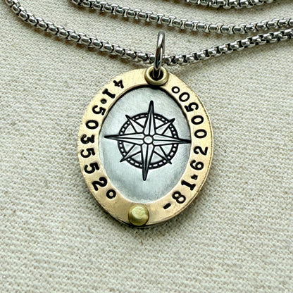 Oval Gold Rimmed custom coordinates necklace with compass rose at center hand stamped and riveted by hand - drake designs jewelry