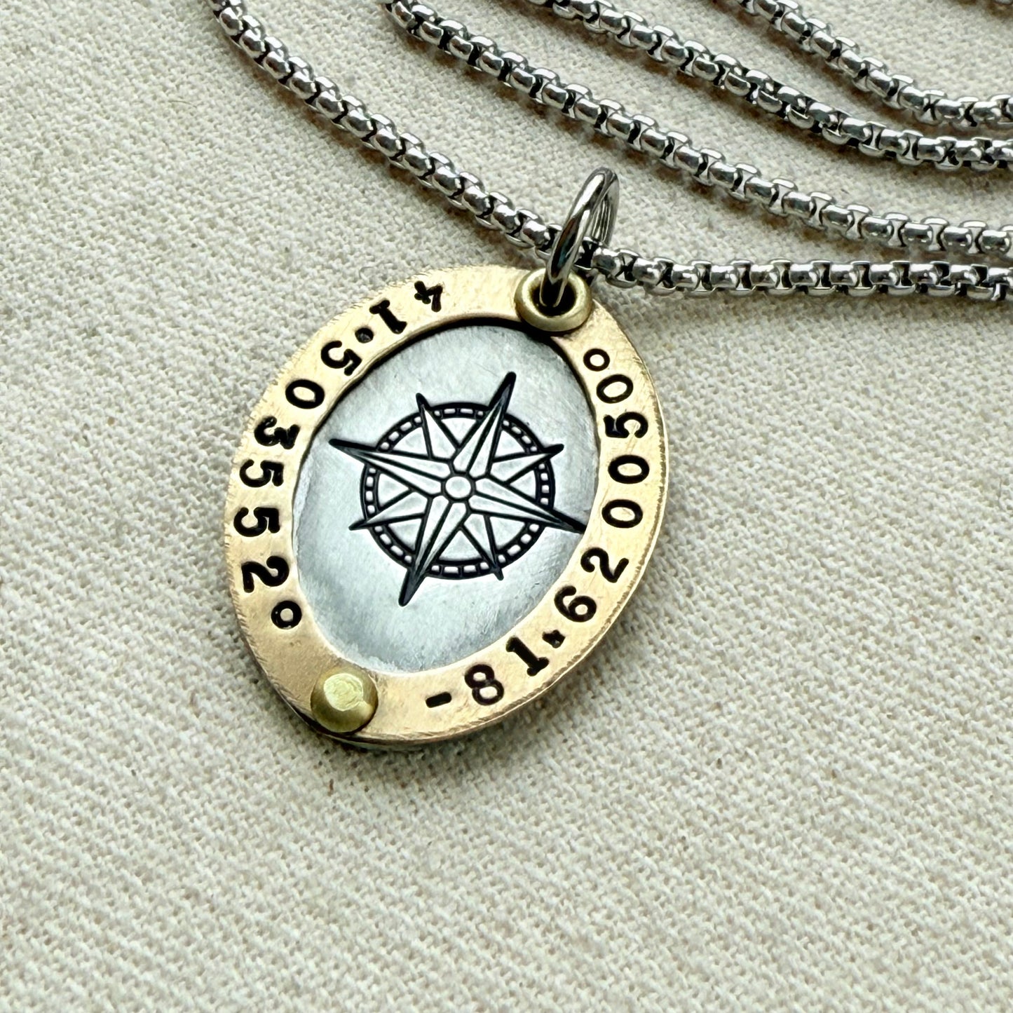 Oval Gold Rimmed custom coordinates necklace with compass rose at center hand stamped and riveted by hand - drake designs jewelry