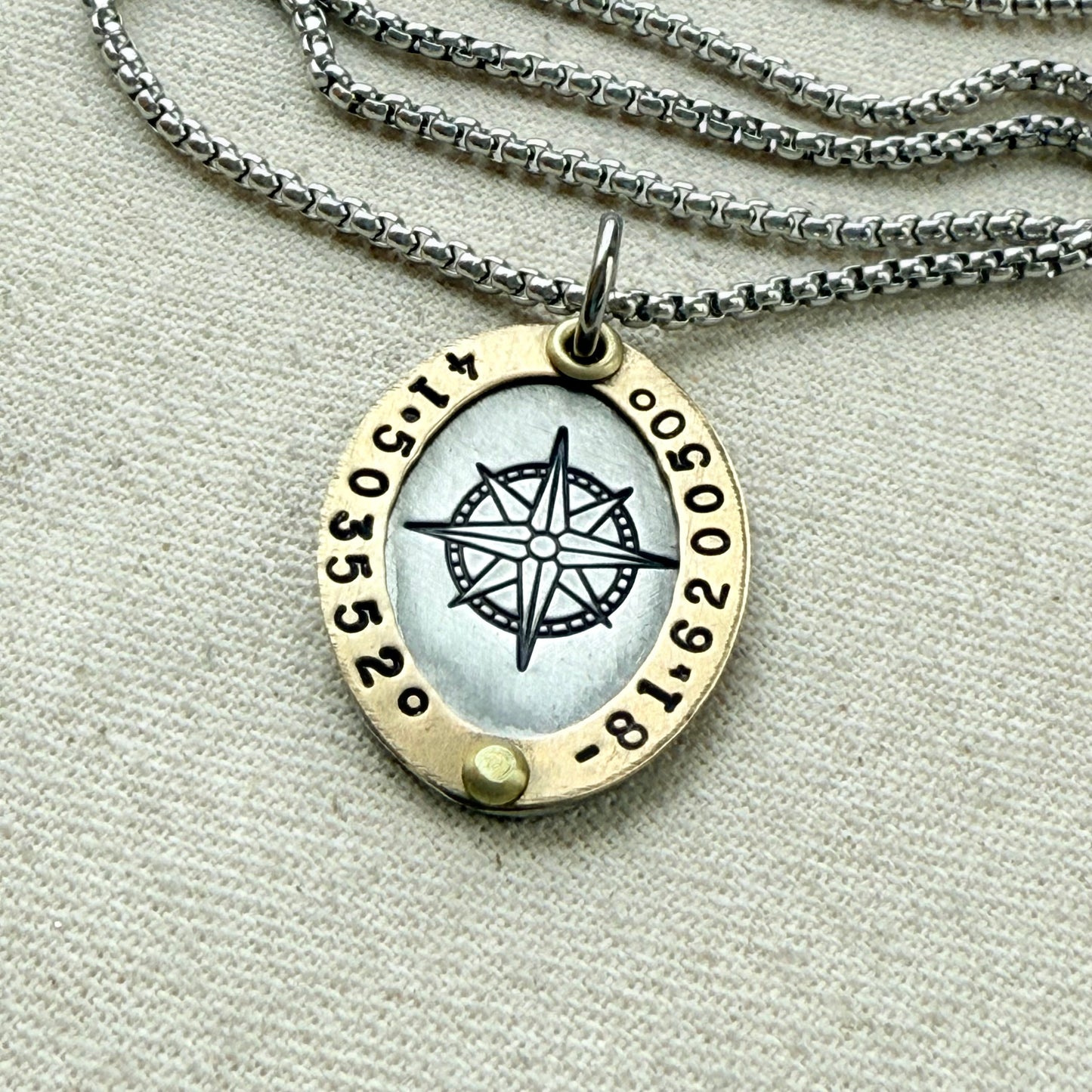 Oval Gold Rimmed custom coordinates necklace with compass rose at center hand stamped and riveted by hand - drake designs jewelry