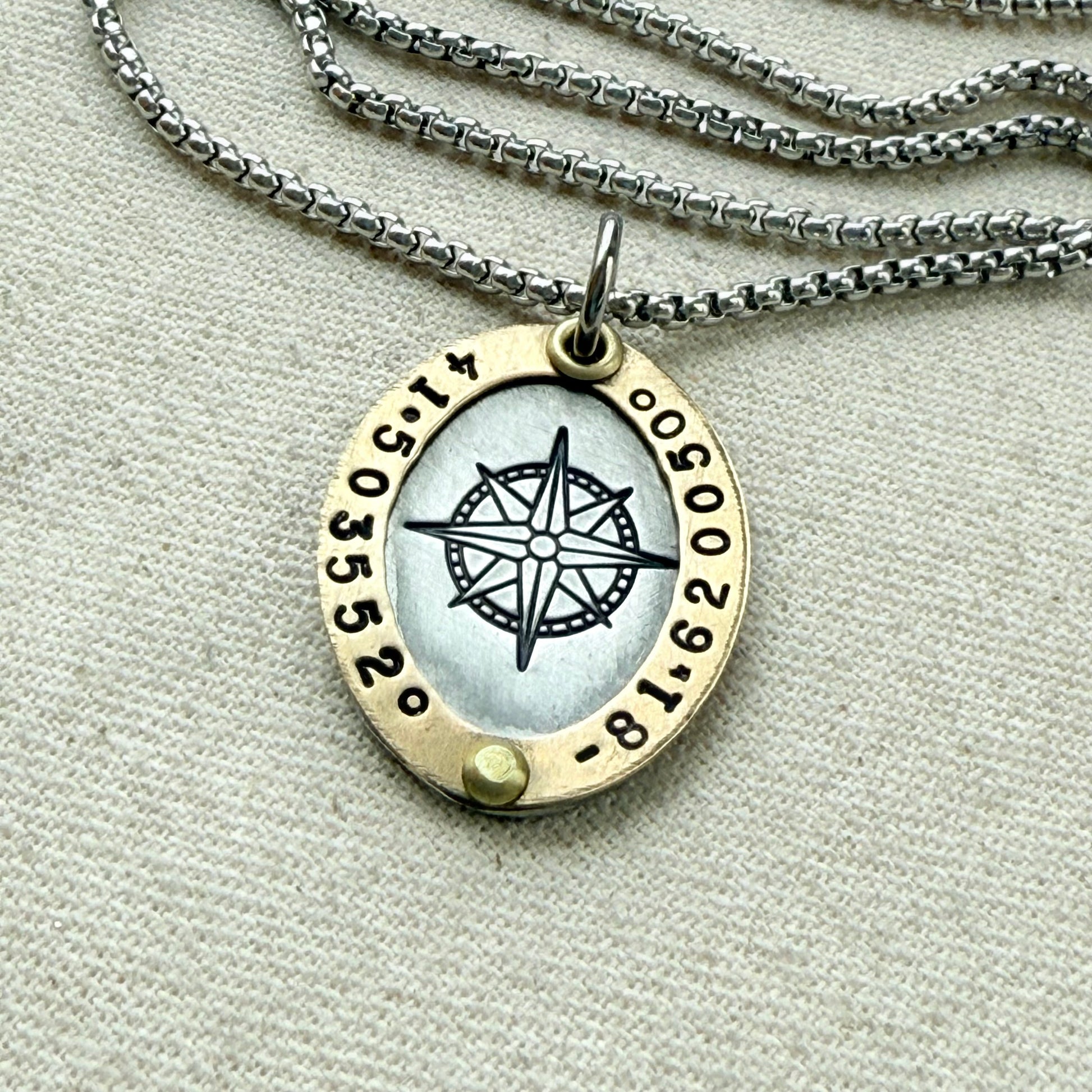 Oval Gold Rimmed custom coordinates necklace with compass rose at center hand stamped and riveted by hand - drake designs jewelry