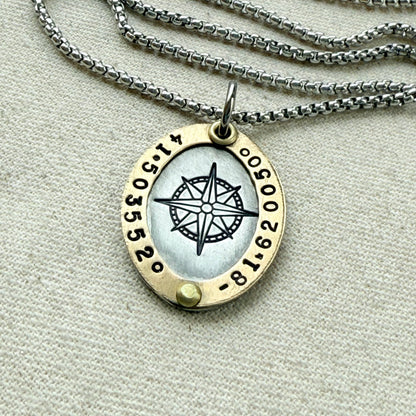 Oval Gold Rimmed custom coordinates necklace with compass rose at center hand stamped and riveted by hand - drake designs jewelry